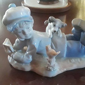 Figurine boy with pup Paul Sebastian 1991